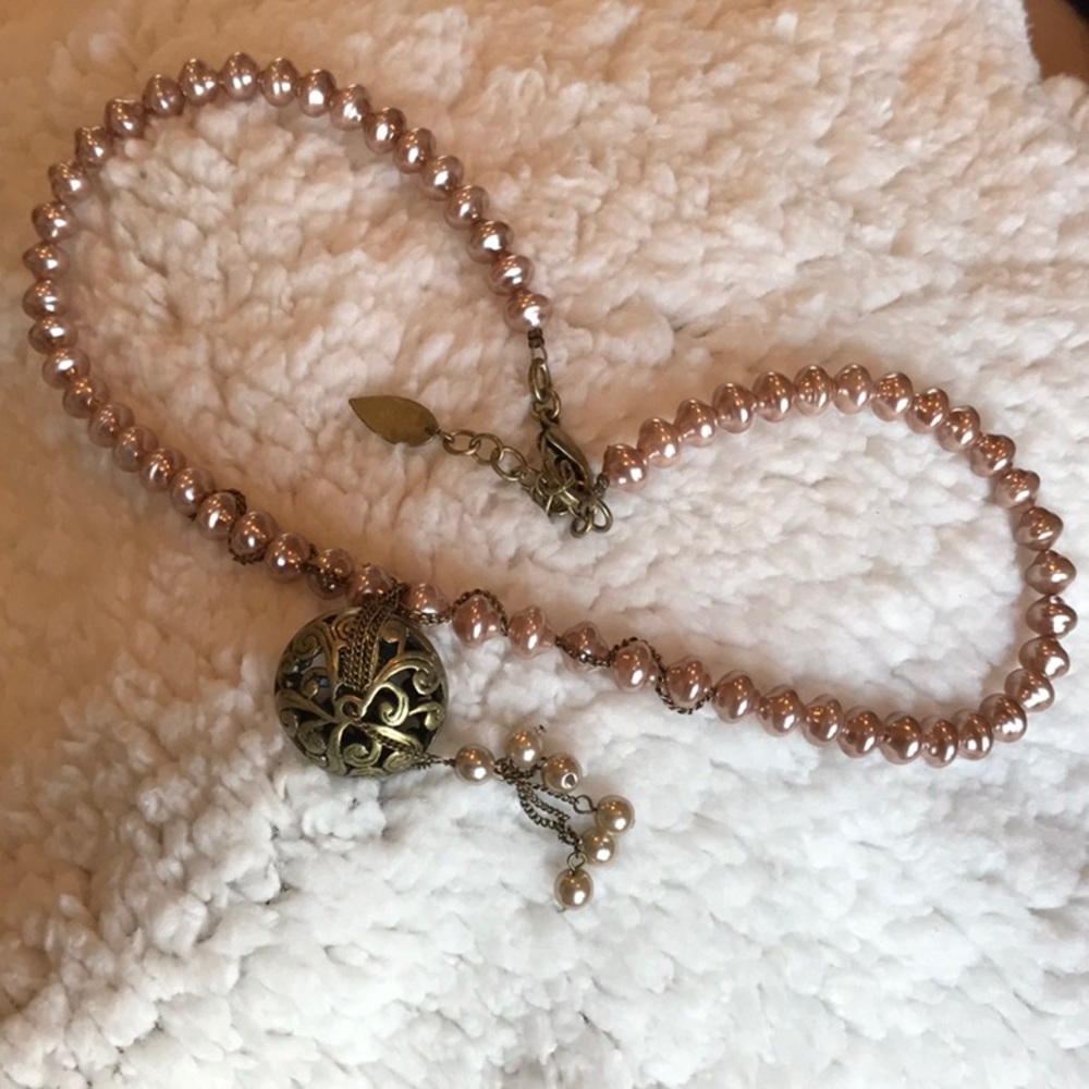 Rose Colored Pearl Necklace with Antique Brass Pendant & 6 ivory pearls.